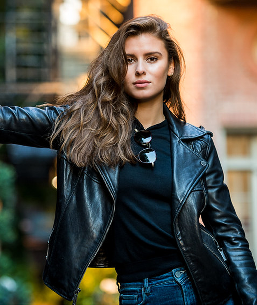 Woman modelling a black leather jacket